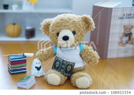 Bear enjoying Halloween decorations Bear enjoying Halloween decorations 106915354