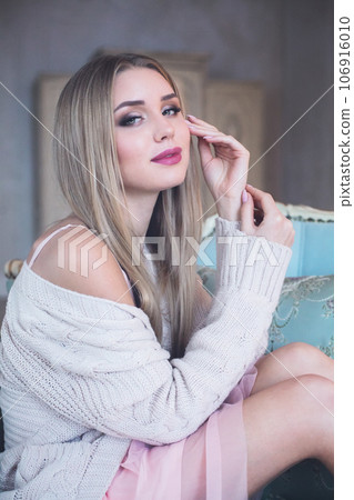 Beautiful blonde woman resting at home, portrait 106916010