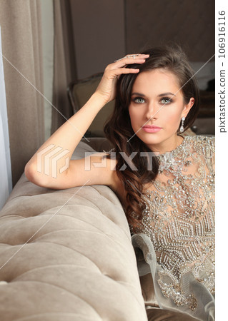 Luxurious glamorous model. Beautiful woman resting in hotel room Luxurious glamorous model. Beautiful woman resting in hotel room 106916116