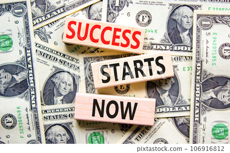 Success starts now symbol. Concept word Success starts now on beautiful wooden block. Dollar bills. Beautiful dollar bills background. Business motivational success starts now concept. Copy space. 106916812