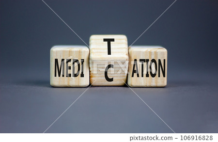 Meditation or medication symbol. Concept word Meditation medication on wooden block on a beautiful grey table grey background. Meditation or medication concept. Copy space. 106916828