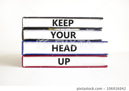 Keep your head up symbol. Concept words Keep your head up on books. Beautiful white table white background. Business motivational keep your head up concept. Copy space. Keep your head up symbol. Concept words Keep your head up on books. Beautiful white table white background. Business motivational keep your head up concept. Copy space. 106916842
