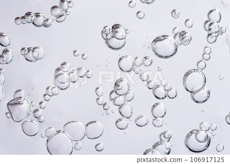Close up macro Aloe vera gel serum cosmetic texture blue background with bubbles. Cruelty free. Lemongrass gel skincare product. antibacterial liquid with aloe vera, moisturizing. Close up macro Aloe vera gel serum cosmetic texture blue background with bubbles. Cruelty free. Lemongrass gel skincare product. antibacterial liquid with aloe vera, moisturizing. 106917125