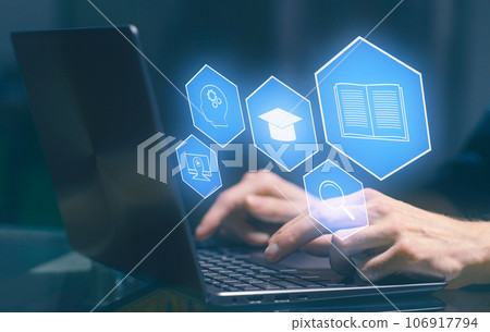 E-learning and Online Education concept. Male student learning lesson process holding hands on computer keyboard. E-learning and Online Education concept. Male student learning lesson process holding hands on computer keyboard. 106917794