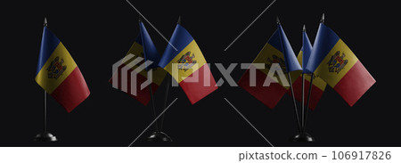 Small national flags of the Moldavia on a black background 106917826