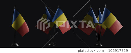 Small national flags of the Romania on a black background Small national flags of the Romania on a black background 106917829
