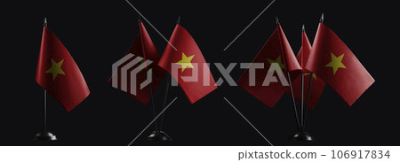Small national flags of the Vietnam on a black background 106917834