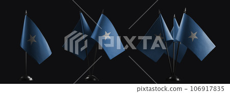 Small national flags of the Somalia on a black background Small national flags of the Somalia on a black background 106917835