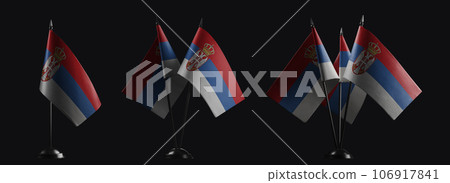 Small national flags of the Serbia on a black background Small national flags of the Serbia on a black background 106917841