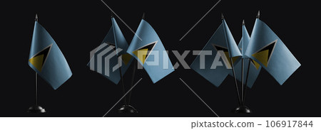 Small national flags of the Saint Lucia on a black background 106917844
