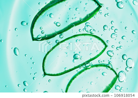Aloe vera slice texture with gel on blue background. Medicinal plant. Flat lay. Top view. Natural herbal medical plant ,skincare ,healthcare and beauty spa concept. Aloe vera slice texture with gel on blue background. Medicinal plant. Flat lay. Top view. Natural herbal medical plant ,skincare ,healthcare and beauty spa concept. 106918054