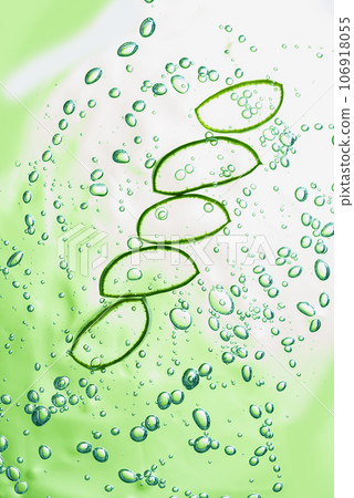 Aloe vera slice texture with gel on green background. Medicinal plant. Flat lay. Top view. Natural herbal medical plant, skincare, healthcare and beauty spa concept. 106918055