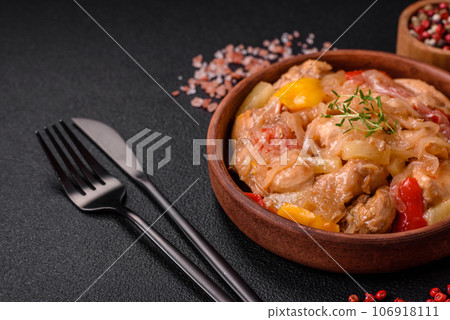 A delicious dish consisting of slices of chicken, sweet peppers and onions A delicious dish consisting of slices of chicken, sweet peppers and onions 106918111