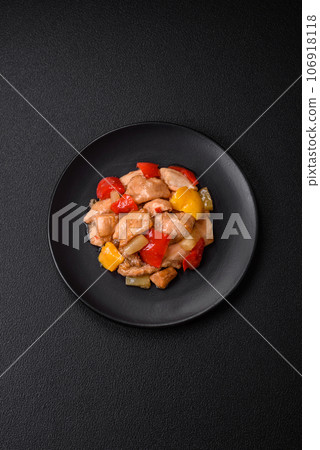 A delicious dish consisting of slices of chicken, sweet peppers and onions A delicious dish consisting of slices of chicken, sweet peppers and onions 106918118