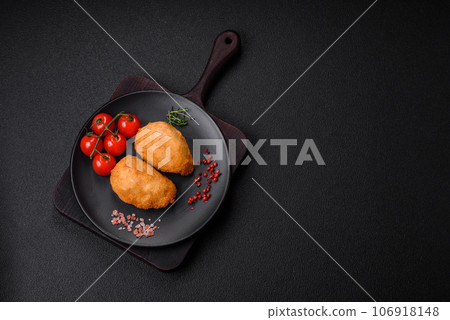 Delicious juicy cutlets or meatballs from minced chicken with salt and spices 106918148