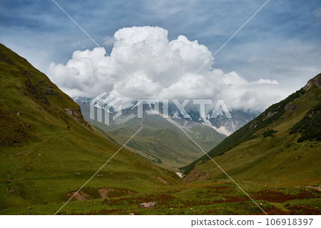 Mountain ranges on a sunny day at Georgia. Sky with clouds adn hills Mountain ranges on a sunny day at Georgia. Sky with clouds adn hills 106918397