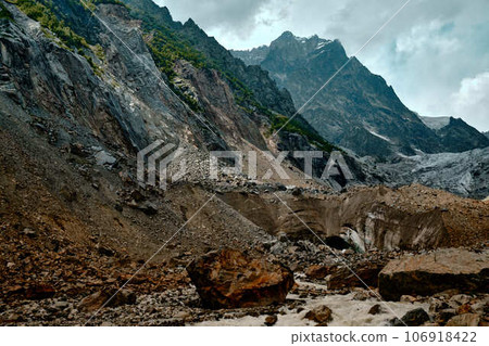 Mountain ranges on a sunny day at Georgia. Sky with clouds adn hills 106918422