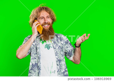 Happy surprised man involved in pleasant conversation phone call good news enjoying talking gossip 106918969