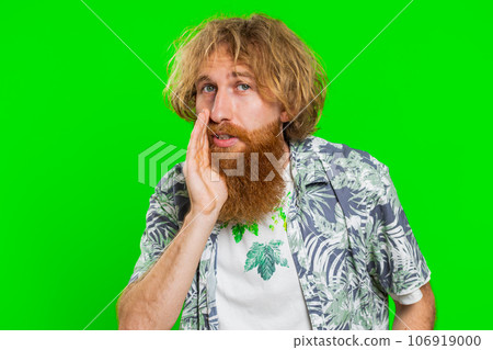 Young man whisper news rumors holding hands near mouth, share gossip, quiet, keep my secrets Young man whisper news rumors holding hands near mouth, share gossip, quiet, keep my secrets 106919000