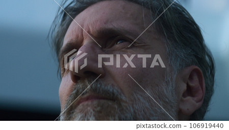 Tired medic takes off glasses, rests after shift 106919440