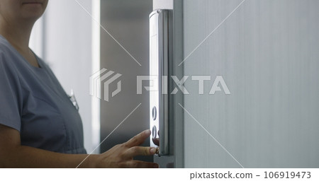 Nurse and elderly patient wait elevator Nurse and elderly patient wait elevator 106919473