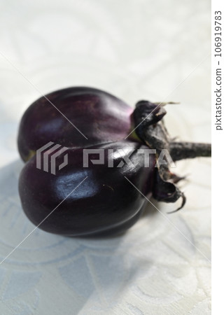Strange and cute eggplants grown in a home garden 106919783
