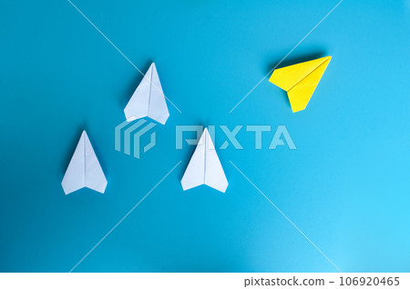 Top view of white and yellow paper airplane. With space for text. Top view of white and yellow paper airplane. With space for text. 106920465