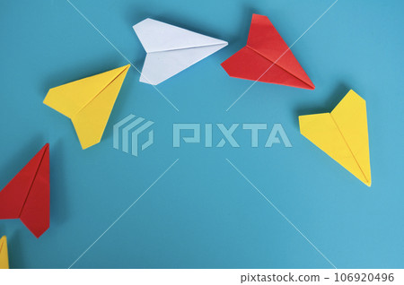 Top view of yellow paper airplane origami leading other paper airplanes. Top view of yellow paper airplane origami leading other paper airplanes. 106920496