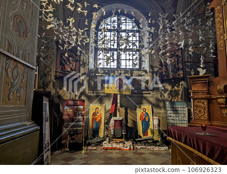 July 2023. Ukraine. Lviv. People brought paper birds and doves to the temple - a symbol of peace. We ask God for peace in Ukraine Decoration of one of the churches in Lviv. July 2023. Ukraine. Lviv. People brought paper birds and doves to the temple - a symbol of peace. We ask God for peace in Ukraine Decoration of one of the churches in Lviv. 106926323