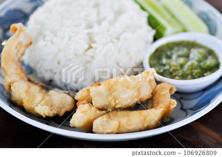 fried fish with rice and dip or fried Snapper,.Red Snapper or .White Snapper fried fish with rice and dip or fried Snapper,.Red Snapper or .White Snapper 106926809