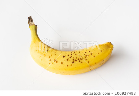 Banana with sugar spots starting to appear, black spots, brown spots 106927498