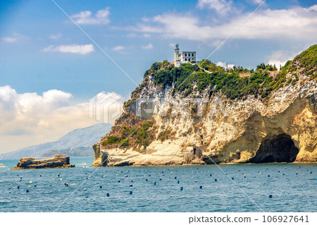 Cape Miseno with its lighthouse in Pozzuoli gulf Cape Miseno with its lighthouse in Pozzuoli gulf 106927641