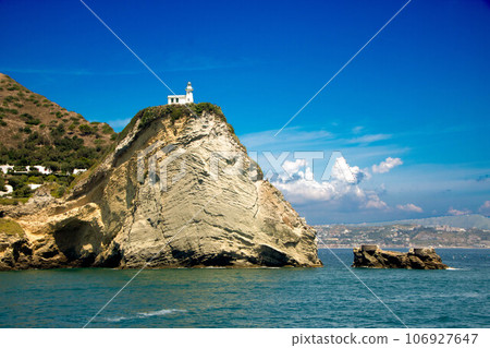 Cape Miseno with its lighthouse in Pozzuoli gulf Cape Miseno with its lighthouse in Pozzuoli gulf 106927647