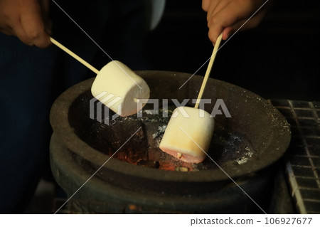 Marshmallow roasted on a charcoal grill Marshmallow roasted on a charcoal grill 106927677