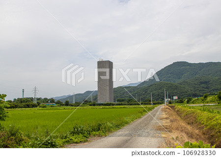 Tower apartment and rural scenery in Kaminoyama City 106928330