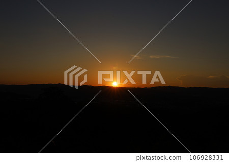 Sunset over the mountains 106928331