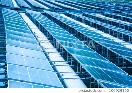 Side view of solar panels floating on water in a lake, for generating electricity from sunlight, selective focus, soft focus. Side view of solar panels floating on water in a lake, for generating electricity from sunlight, selective focus, soft focus. 106929500