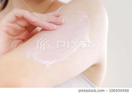 Woman applying cream to her arm for beauty Woman applying cream to her arm for beauty 106930488