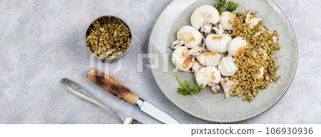 Baked calamari with nuts, space for text. Baked calamari with nuts, space for text. 106930936