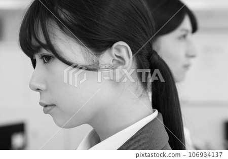 Monochrome image of a female employee on bad terms Monochrome image of a female employee on bad terms 106934137
