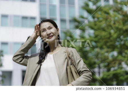 Senior woman avoiding the sun 106934851