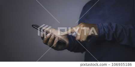Young man using smartphone. 106935186