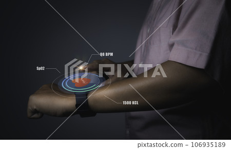Man using smart watch technology checking heart rate. Man using smart watch technology checking heart rate. 106935189