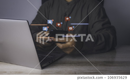 Man using smartphone with social media to interactions icon. 106935629