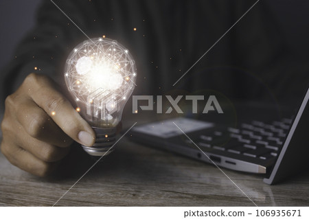 Creative idea and innovation. Businessman holding light bulbs the idea 106935671