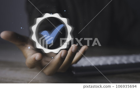 Man holding quality assurance icon or QA and Quality Control or QC. Man holding quality assurance icon or QA and Quality Control or QC. 106935694