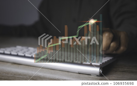 man using computer with stock market graph financial profit stock development. man using computer with stock market graph financial profit stock development. 106935698