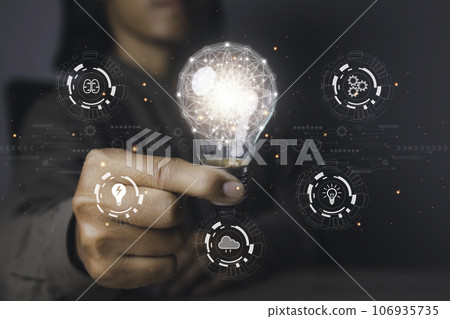 Businessman holding bright light bulb with icons Idea, Brainstorm, Innovation. Businessman holding bright light bulb with icons Idea, Brainstorm, Innovation. 106935735