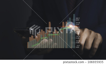 Stock market graph with man working on computer stock trading screen. Stock market graph with man working on computer stock trading screen. 106935935