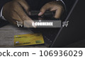 Businessman using mobile phone and credit card shopping online. 106936029